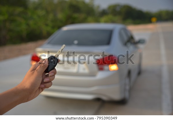 Woman holding a\
remote control car\
control.