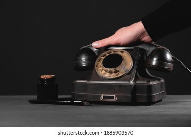 Woman Is Holding A Rotary Phone Handset Close Up.