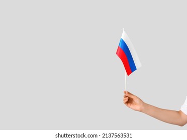 Woman Holding Russian Flag On Grey Background