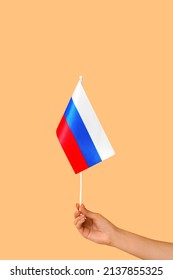 Woman Holding Russian Flag On Color Background, Closeup