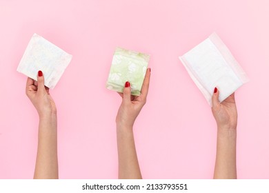 Woman Holding Sanitary Pad On Pink Background