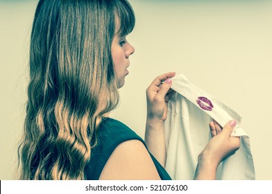 Woman Holding A Shirt With Red Kiss Lipstick Of Her Unfaithful Husband - Retro Style