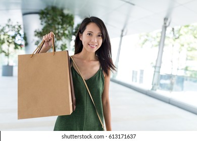 Woman holding shopping bag - Shutterstock ID 613171637