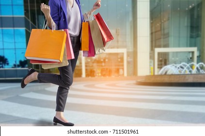 
woman holding shopping bag in mall