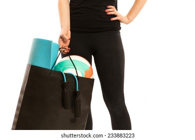 Woman Holding Shopping Bag With Sports Equipment