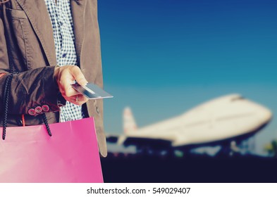 Woman Holding Shopping Bags ,airport Background