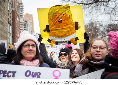 Woman Holding Sign With Trump Baby Helium Balloon During NYC Women's March 2019 New York, NY, USA January 1/19/2019 Women's March