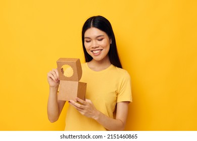 Woman Holding A Small Box Gift Yellow Background