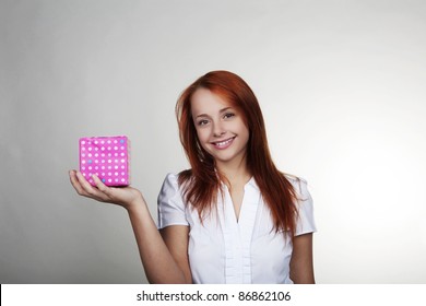 Woman Holding A Small Box Wrapped Up