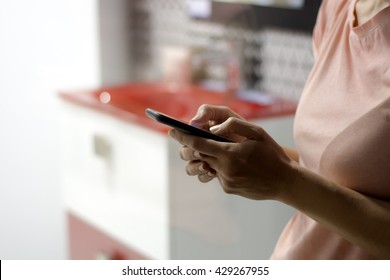 Woman holding smart phone in her hands, writting text message, standing  - Shutterstock ID 429267955