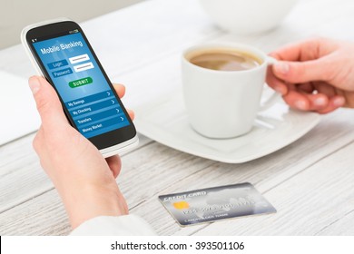 Woman Holding Smart Phone With Mobile Banking Application On A Screen.