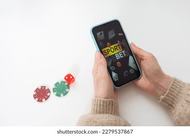woman holding smartphone betting. online sport gambling application on her mobile phone. - Shutterstock ID 2279537867