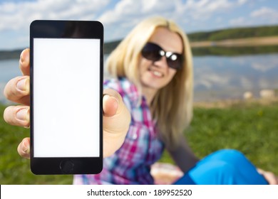woman holding smartphone in hand