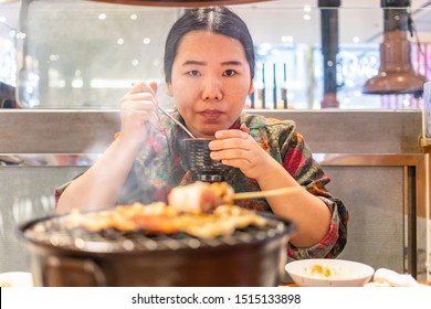 Woman Holding Spoon And Bowl Of Soup, Woman Sipping Soup From Spoon