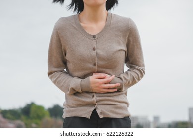 Woman Holding Stomach