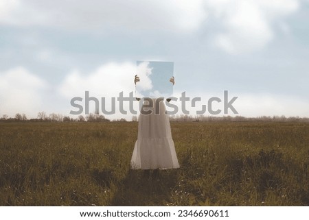 woman holding a surreal painting of the sky in front of her face, abstract concept