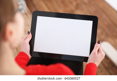 Woman Holding Tablet In Hands