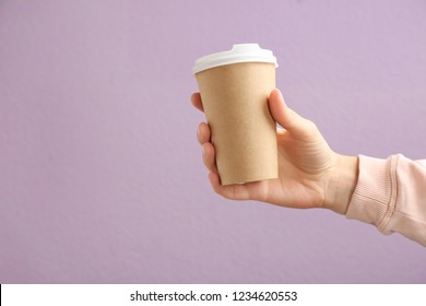 Woman Holding Takeaway Paper Coffee Cup On Color Background. Space For Design