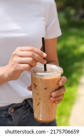 Woman Holding Takeaway Plastic Cup With Cold Coffee Drink Outdoors, Closeup