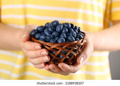 Woman Holding Tasty Fresh Blueberries, Closeup View