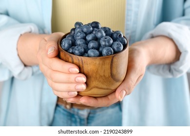 Woman Holding Tasty Fresh Blueberries, Closeup View