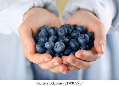 Woman Holding Tasty Fresh Blueberries, Closeup View