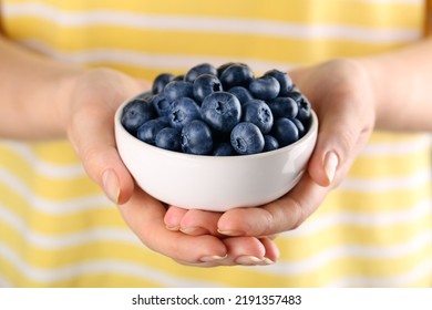 Woman Holding Tasty Fresh Blueberries, Closeup View