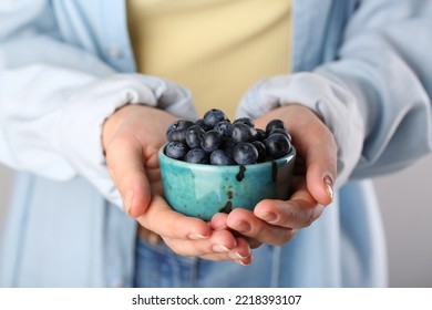 Woman Holding Tasty Fresh Blueberries, Closeup View