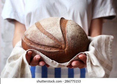 Woman Holding Tasty Fresh Bread, Close Up