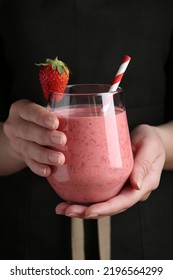 Woman Holding Tasty Strawberry Smoothie, Closeup View