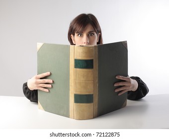 Woman Holding A Thick Book