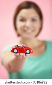 Woman Holding Toy Car