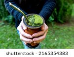 Woman holding a Traditional South American Yerba Mate tea (chimarrão in Brazil)