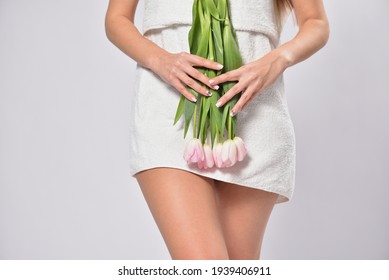 Woman Holding Tulips In Crotch Area , Intimate Hygiene Concept