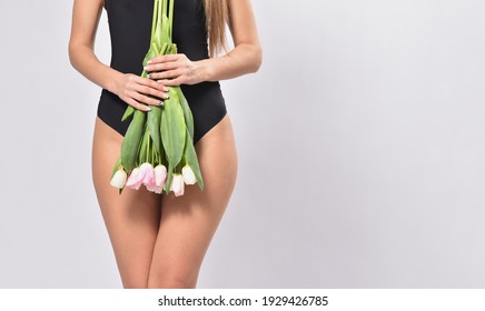 Woman Holding Tulips Flowers In Intimate Area, Intimate Depilation And Hygiene Concept