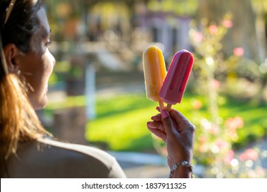 Woman Holding Two Popsicles Fruit