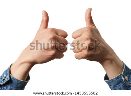 Woman holding two thumbs up into the air isolated on white
