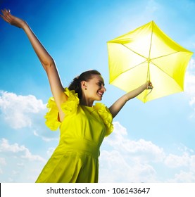 Woman Holding Umbrella Against Sun And Sky