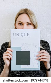 Woman Holding A Unique Magazine