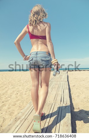 Similar – Young, slim woman on the beach of the Baltic Sea in summer wind