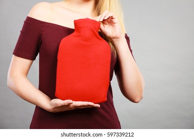 Woman Holding Warm Red Hot Water Bottle. Fever, Flu Treatment Objects Concept.