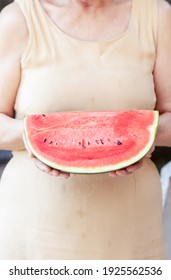 Woman Holding Watermelon In Her Hands