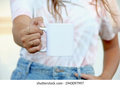 Woman holding white coffee mug.  white porcelain mug mock up  - Shutterstock ID 1943097997