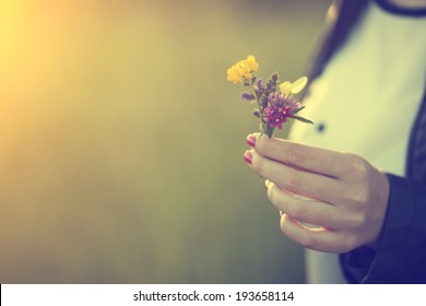 Woman Holding Wild Flowers