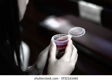 Woman Holding Wine In A Holy Communion. 