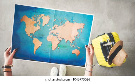 Woman Holding World Map Travel Concept