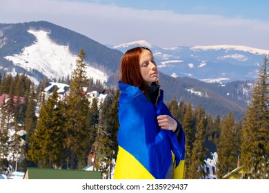 Woman Holding,carring Ukrainian National Blue Yellow Flag.war,conflict,military Invasion Beetwen Russia As Terrorist Aggressive Cruel Country And Ukraine.Ukraines Independence Flag,Constitution Day.