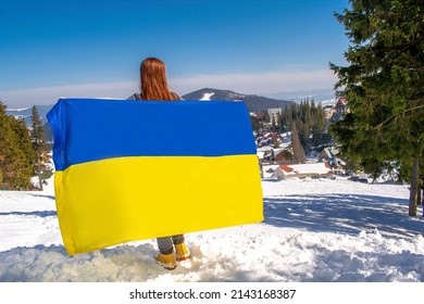 Woman Holding,carring Ukrainian National Blue Yellow Flag.war,conflict,military Invasion Beetwen Russia And Ukraine.Ukraines Independence,Flag,Constitution Day.