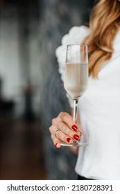 Woman Holds A Glass Of Cold Prosecco In Her Hand,