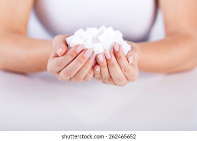 Woman Holds In Hands Of A Handful Of Sugar Cubes